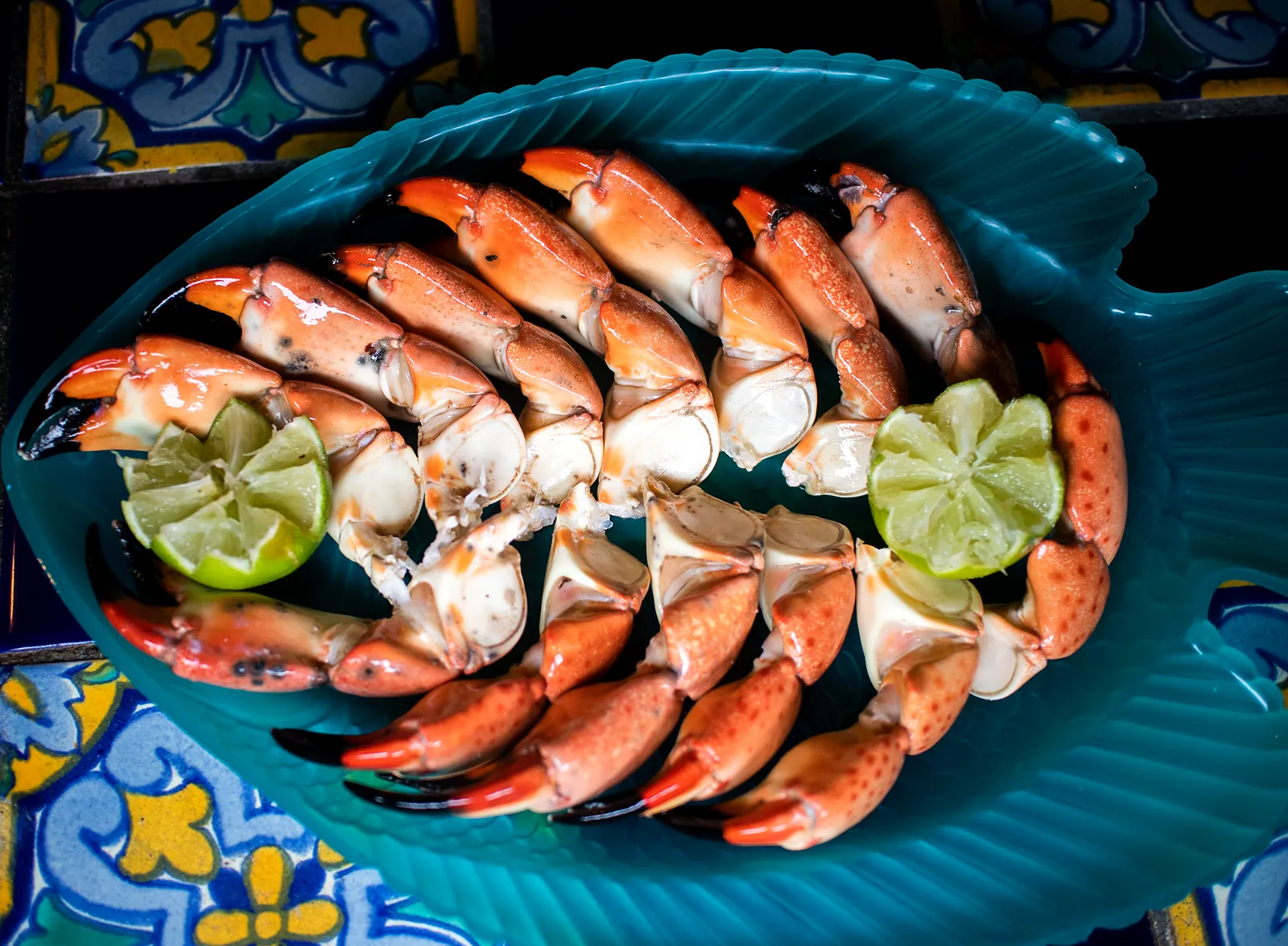 A platter of stone crab claws with lime
